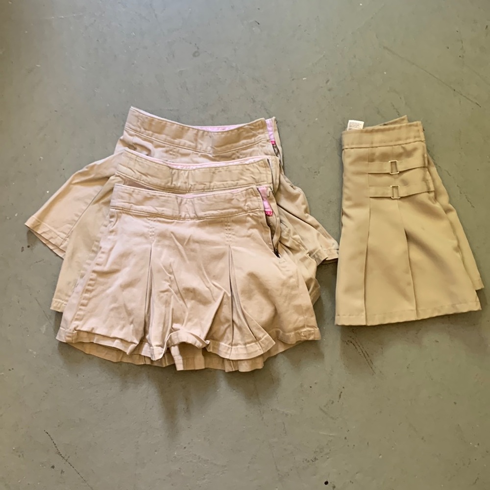 Four uniform skorts sized 8